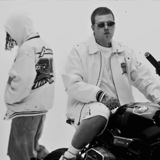 Black and white photo of Yung Lean and Bladee wearing white outerwear and sunglasses.
