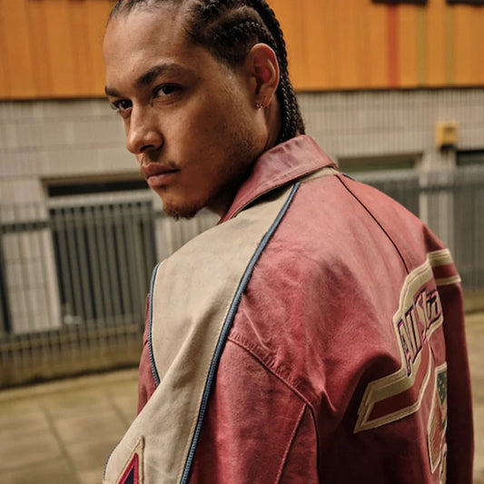 Side view of a man wearing a vintage red and cream Avirex leather varsity jacket